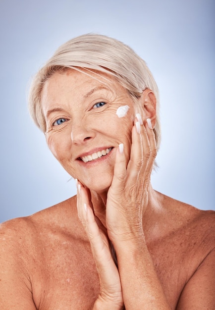 Sunscreen portrait and skincare senior woman in studio for beauty skin healthcare and antiaging wellness Elderly or old woman model cream product for facial skin care or dermatology advertising