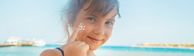 Photo sunscreen on the skin of a child. 