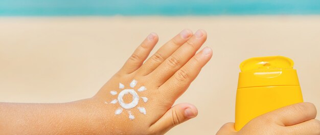 Photo sunscreen on the skin of a child. 