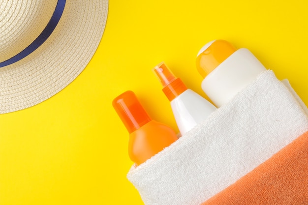 Sunscreen. various sunscreens and summer accessories. summer. vacation. top view