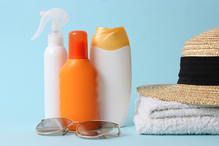 Sunscreens on a colored background close-up. Sun protection for skin, prevention of skin cancer. Safe tan. High quality photo