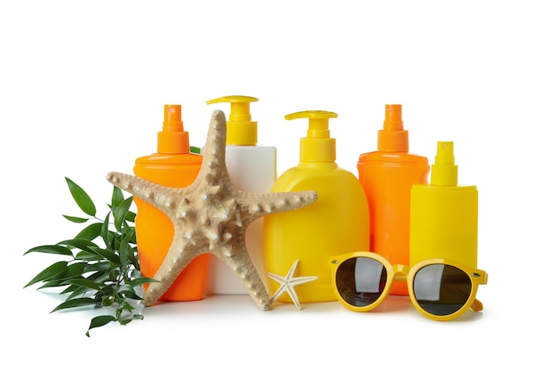 Sunscreens and summer accessories isolated on white isolated background