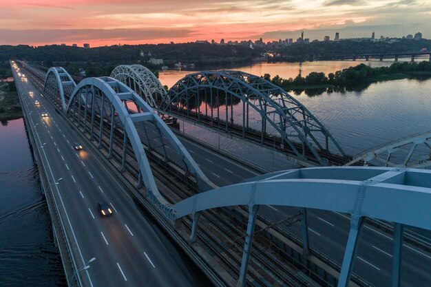 Sunset aerial view on a Darnitsky Bridge in Kyiv Ukraine