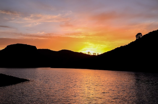 Sunset on the Atlantic Ocean with a Mountain in Background El Medano Tenerife Canary Islands Spain