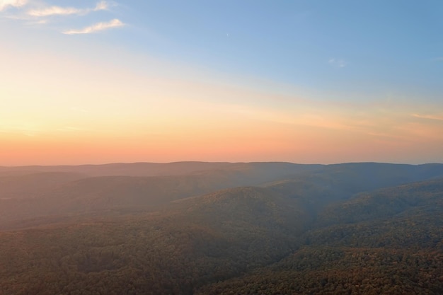 Sunset over Autumn forest. Aerial view autumn landscape