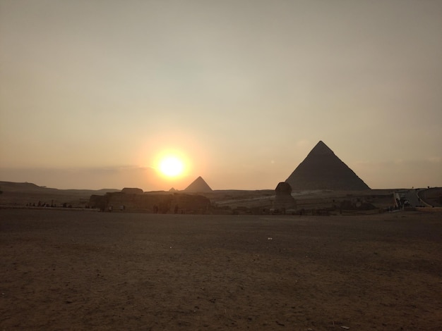 Sunset on the background of the Egyptian pyramids