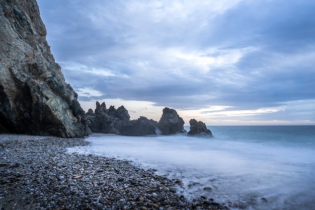 Sunset at beach on cloudy day