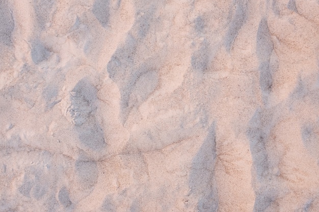 Sunset on the beach. Sand texture