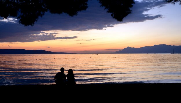 Sunset at the beach with people