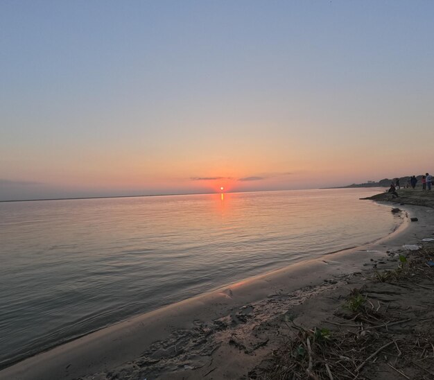 A sunset over a body of water