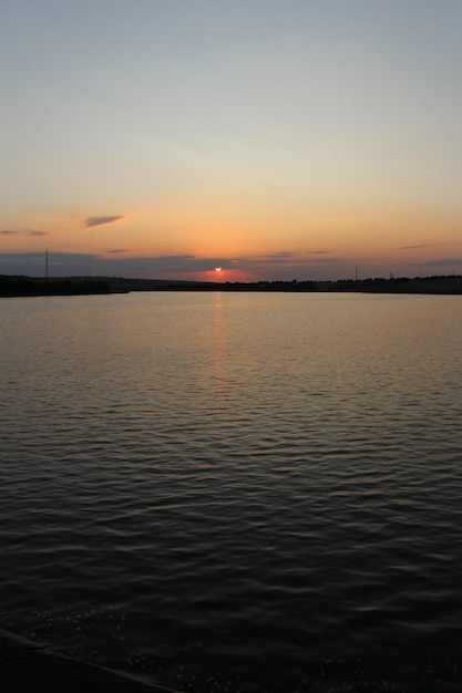 A sunset over a body of water