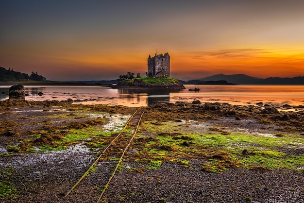 Sunset over Castle Stalker Scotland United Kingdom