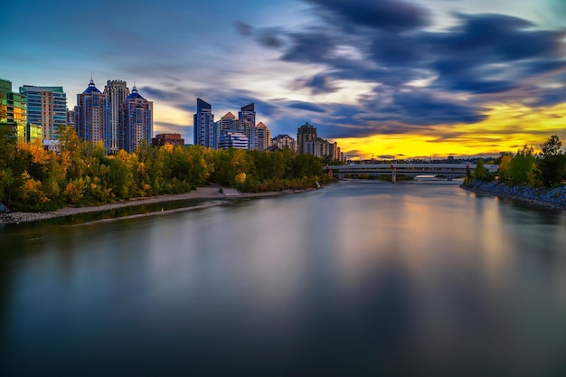 Sunset above city skyline of Calgary with Bow River Canada