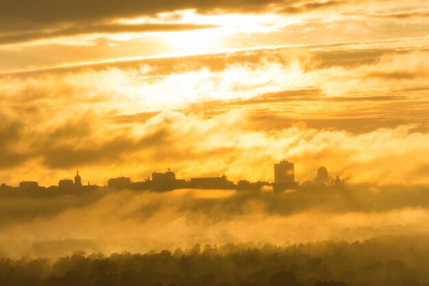 Sunset in city with fog