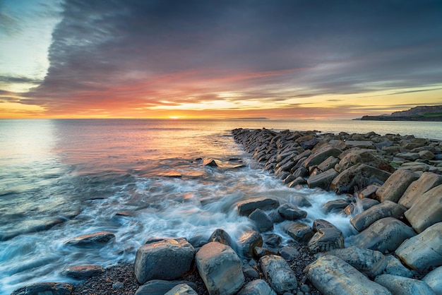 Sunset over Clavell Pier in Dorset