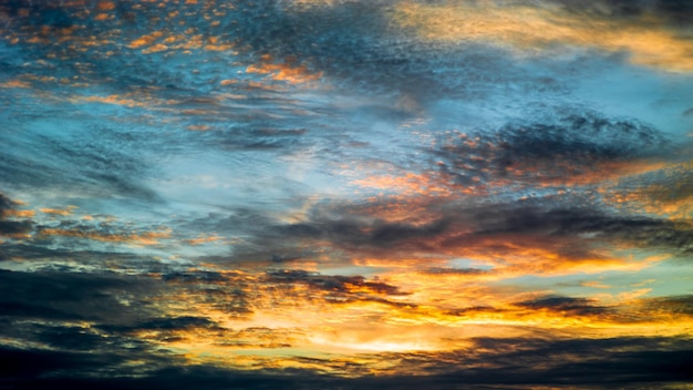 Sunset clouds nature background. Golden hour. Beautiful cloudscape