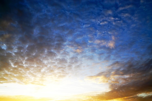 Sunset clouds sky with sun setting down