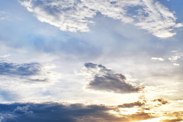 Sunset clouds with sun setting down Beautiful evening sky with clouds background