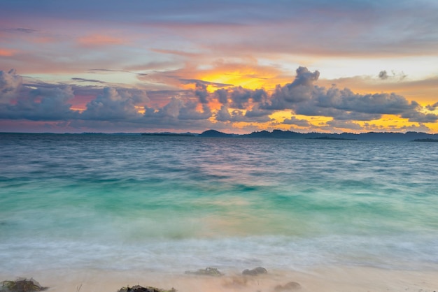 Sunset colorful sky on sea tropical desert beach no people dramatic clouds travel destination getting away long exposure Indonesia Sumatra Banyak Islands