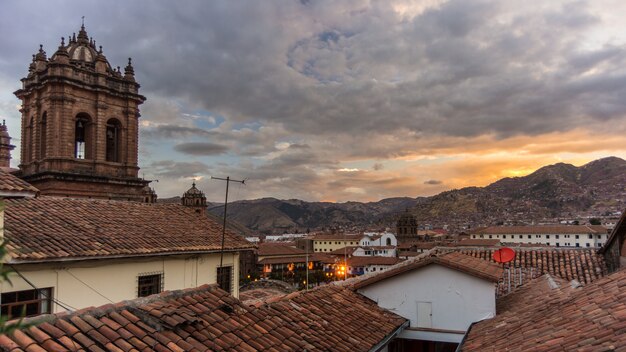 Sunset over Cusco, Peru, with storm clouds