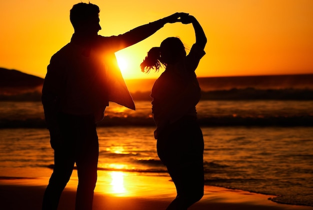 Sunset dance and silhouette of couple by the beach together for love travel and Puerto Rico holiday Summer sunrise and nature with man and woman dancing by the sea for vacation happy and relax