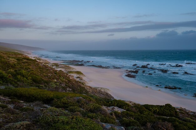 Sunset at de hoop nature reserve south africa western cape most\
beautiful beach of south africa with the white dunes at the de hoop\
nature reserve which is part of the garden route
