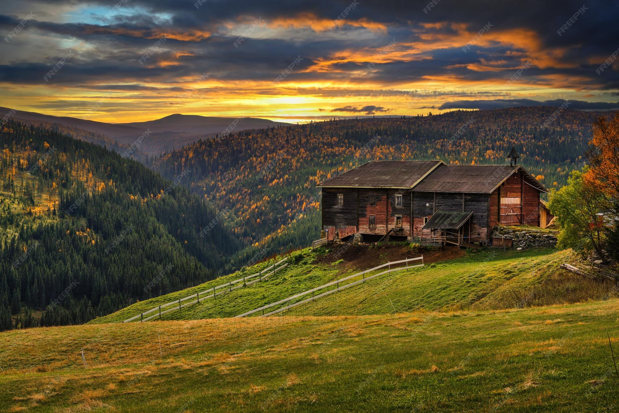 Premium Photo | Sunset over a farmhouse barn in autumn near rondane  national park norway