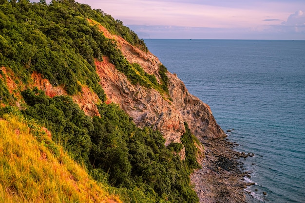 Sunset at Giant cliff at Larn island Koh Larn Beautiful of sea at Chonburi Thailand