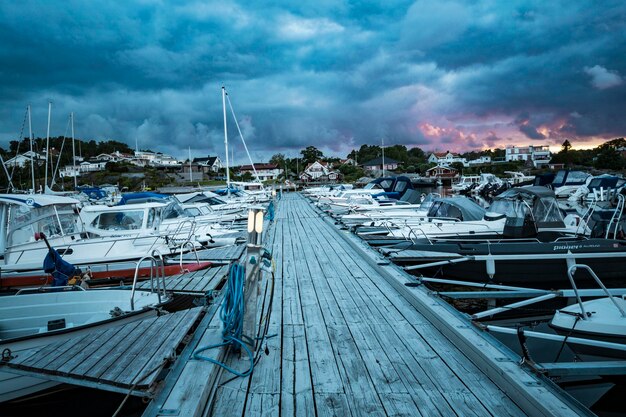 Sunset in harbour against stormy clouds