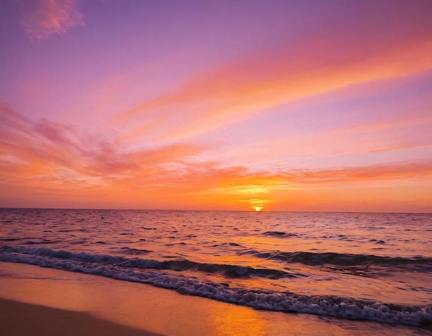 a sunset is on the beach and the sky is pink and purple