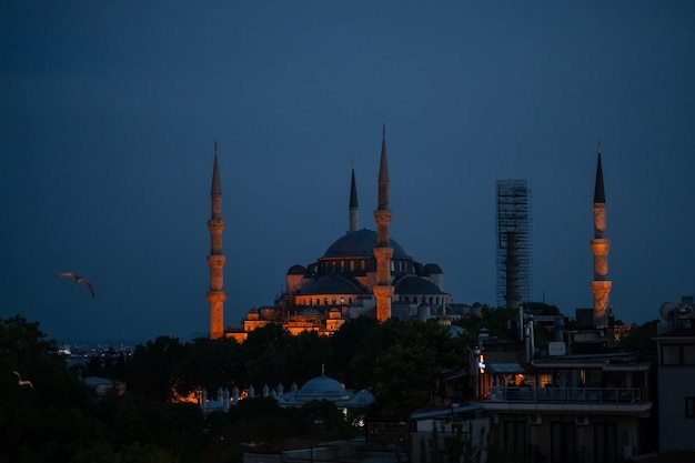 Sunset in Istanbul Turkey view of the mosque illuminated by bulbs