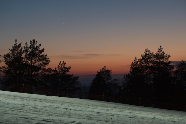 Photo sunset landscape on ski resort in russia, wide angle
