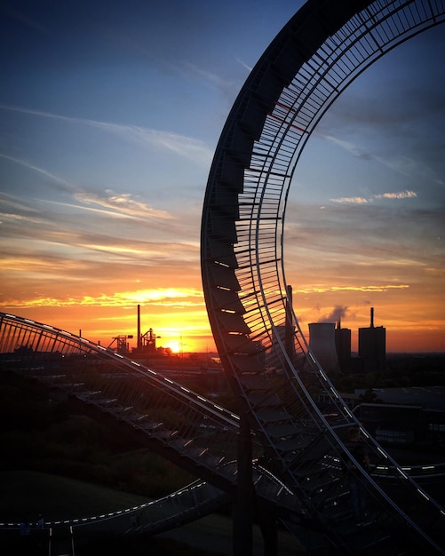 Sunset over the Magic Mountain and Huckingen power plant near Duisburg North RhineWestphalia Germ