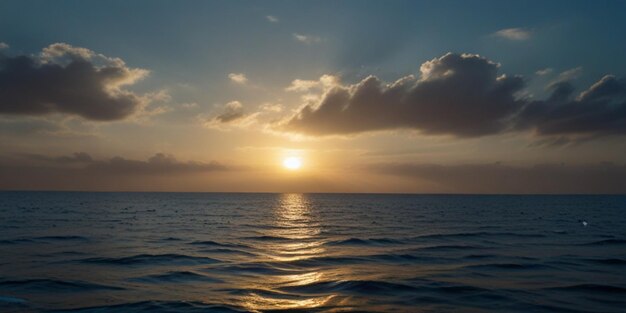 Photo a sunset over the ocean with clouds and the sun setting