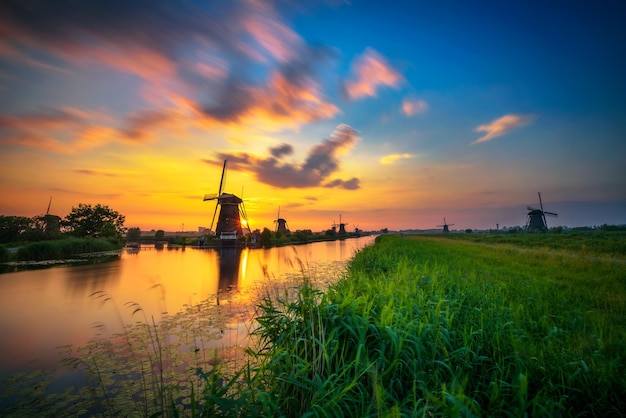 Sunset above old dutch windmills in Kinderdijk Netherlands