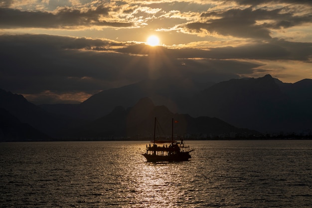 Sunset and old tourist boat