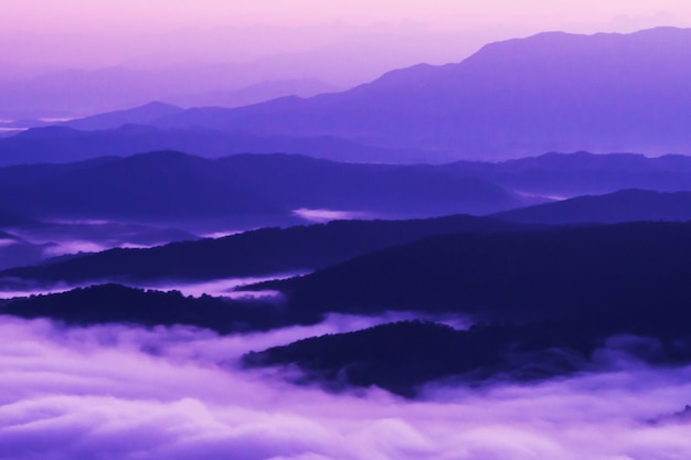  sunset overlooking mountains with Mist