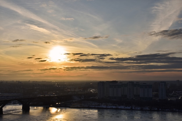 Sunset over a road bridge over the river