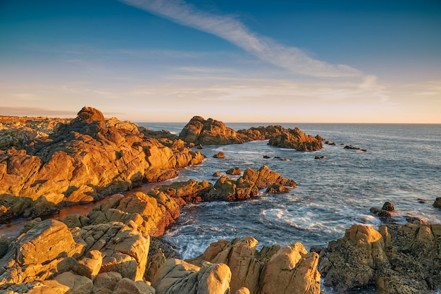 Sunset between the rocks of the Galician coast.