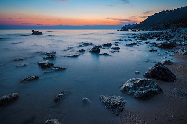 Sunset at rocky coast