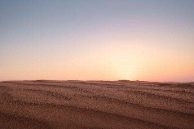 Sunset over the sand dunes in the desert