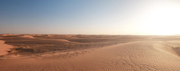 Sunset over the sand dunes in the desert