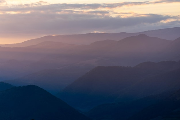 Sunset scene landscape with mountains peaks