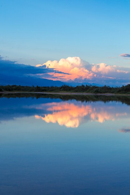 Sunset on the sea, beautiful mountains and clouds