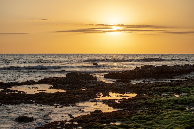 Sunset over the sea in the caribbean in Dominicus beach in Dominican Republic