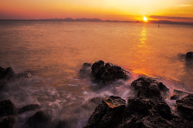 Sunset over the sea long exposure techniques