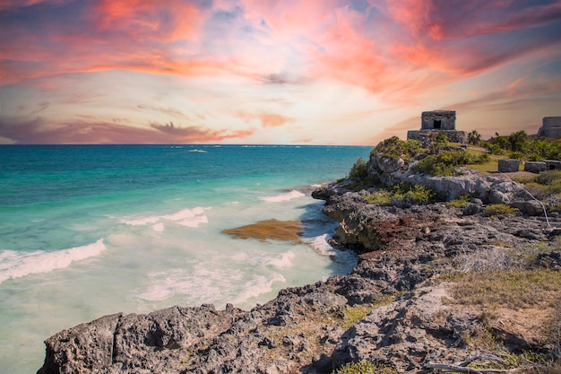 Sunset at the sea next to the Mayan temples of Tulum in Mexico