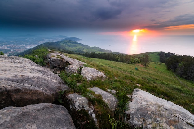 Sunset at the sea seen from the top of Jaizkibel mountain at the basque coast