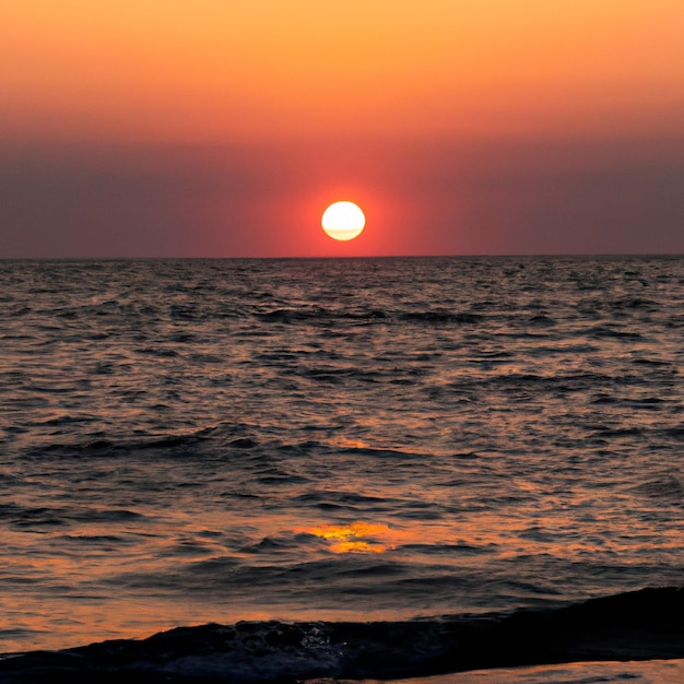 sunset on the sea, the sun above the horizon.