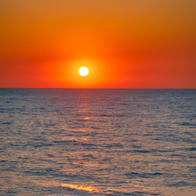 sunset on the sea, the sun above the horizon.